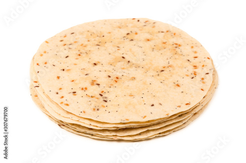 Pitta bread with seeds isolated on white