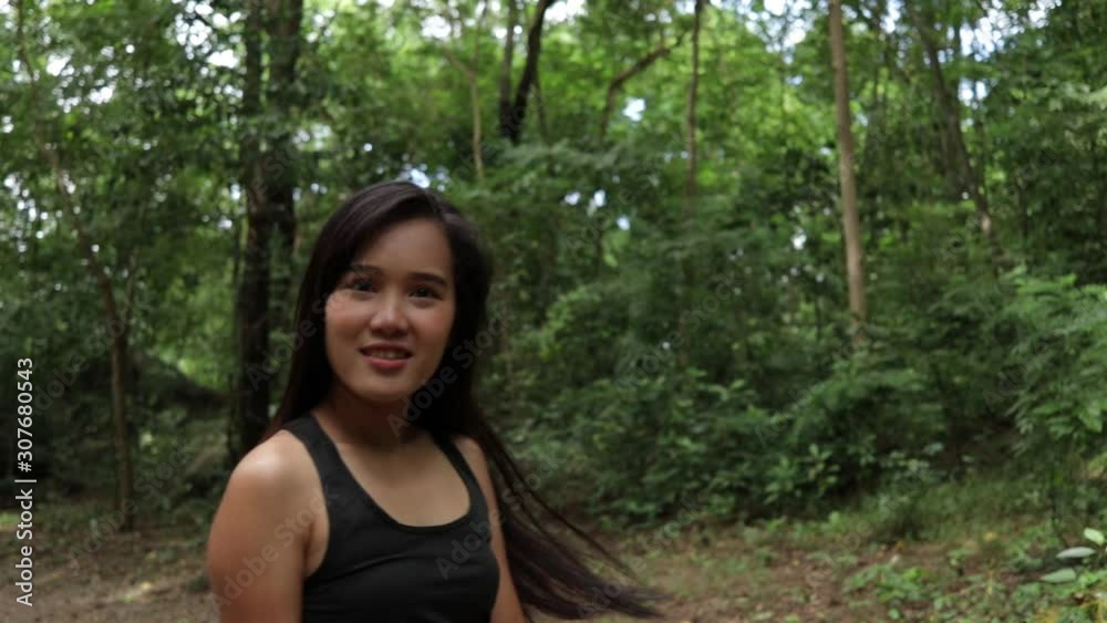 Young asian women turn around and Flick hair in nature background. Young asian women turn around and Flick hair in nature background.