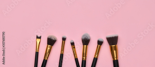 Fashion cosmetic makeup Set. Minimal. Beauty product on pink background. Trendy accessories, cosmetics, brushes art fashionable Flat lay. Creative colorful make up concept, banner