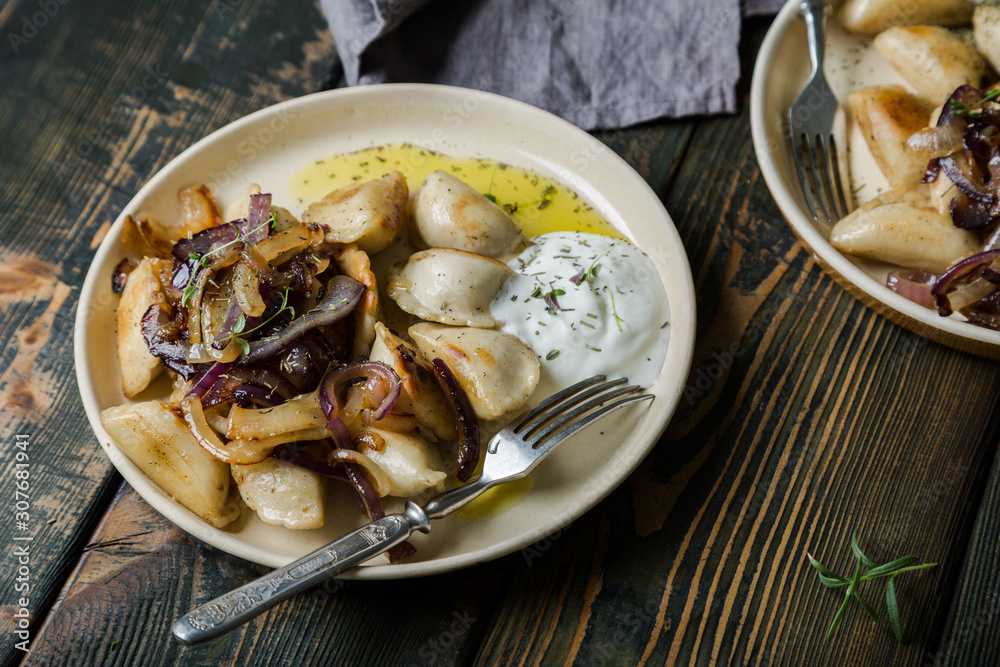 Dumplings, pierogi, pelmeni, ravioli with fried onions Dumplings, pierogi, pelmeni, ravioli with fried onions