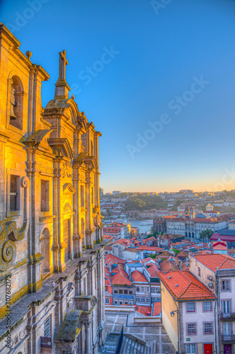 Sunset view of saint Lawrence church and Palacio da Bolsa at Porto, Portugal photo