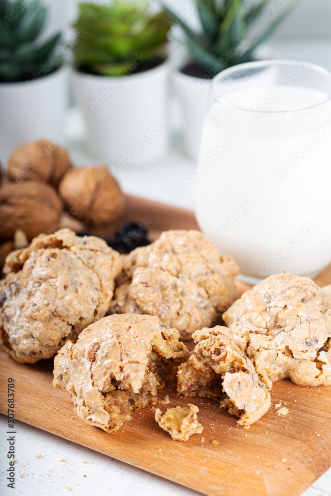 Crispy cookies with walnut and tahini and glass of milk
