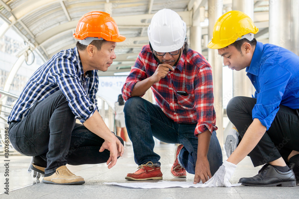 Contractor discussing together before build up follow drawing Contractor discussing together before build up follow drawing