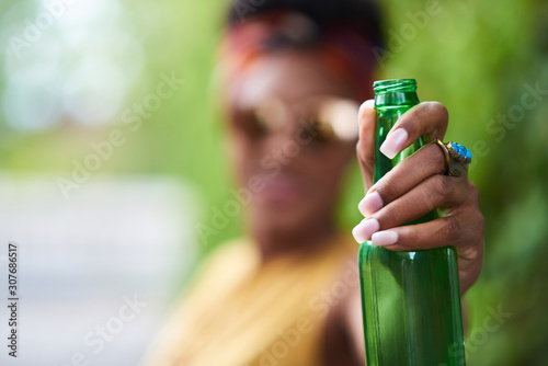 Sticker Attractive young african american woman having a drink listening