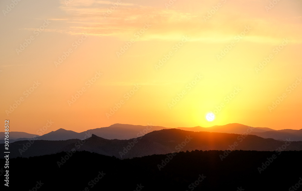 Landscape, sunset in the sky against the mountains, mountain ranges during sunset
