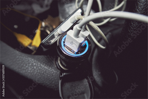Obraz na plátně A usb car 12 volt usb cigarette lighter charging port in the interior of a messy car