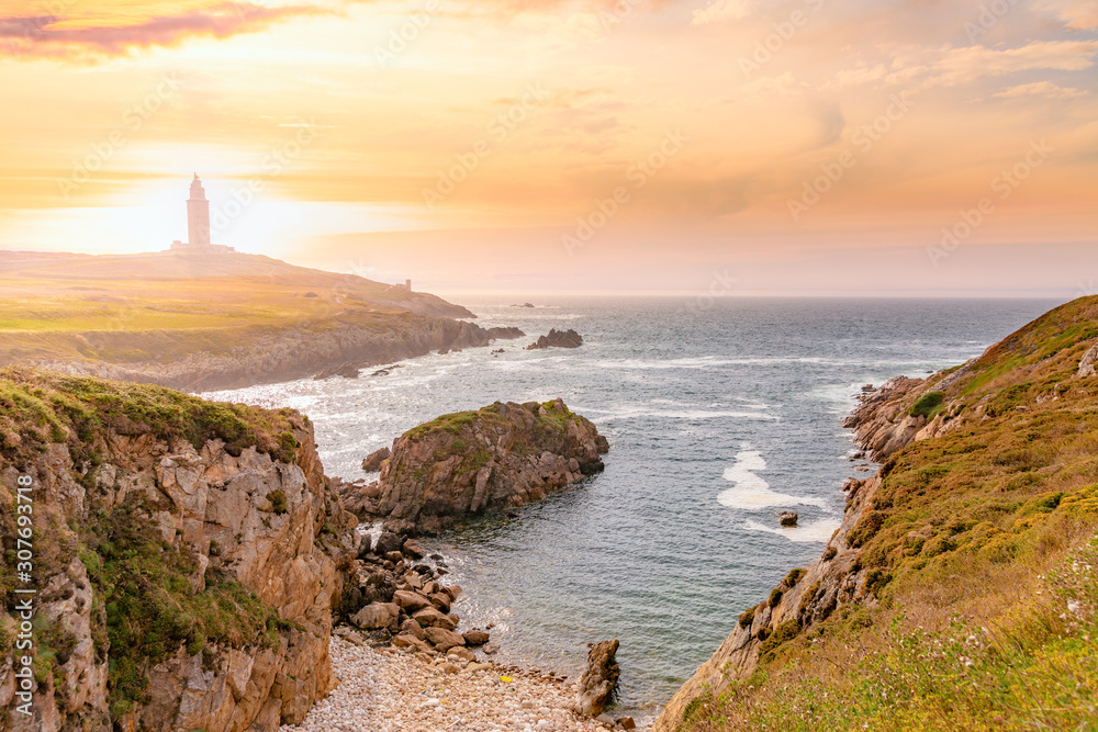 Fototapeta premium Spain, Galicia, La Coruna. Torre de Hercules at sunset