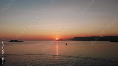 Calm Adriatic Seas from the Croatian coastline from Cavtat. The last of the sunset dipping behind the mountainous backdrop.