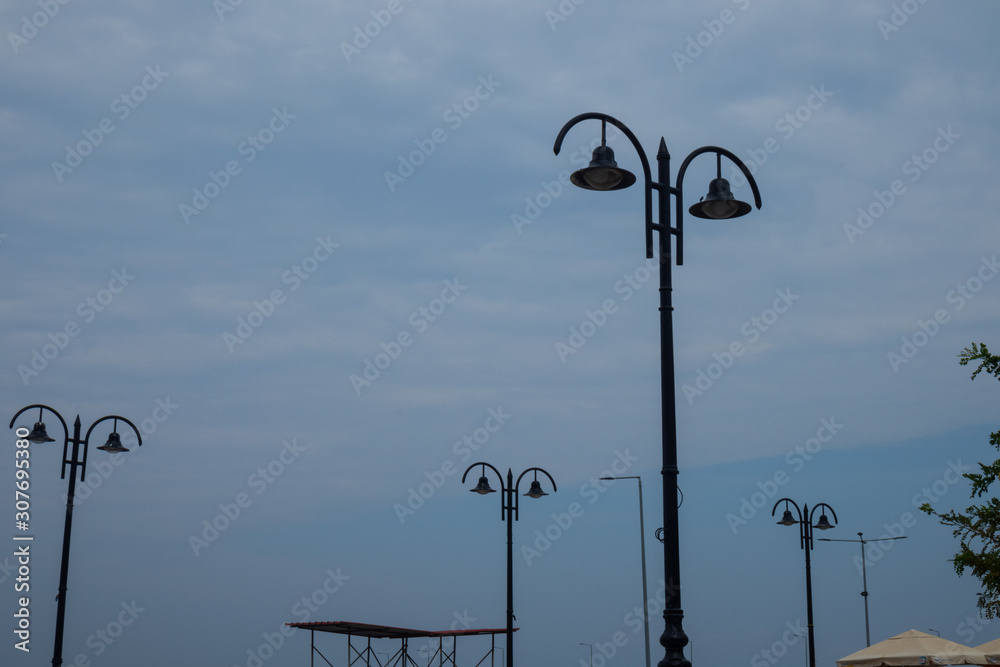 cloudy sky with lamp stand