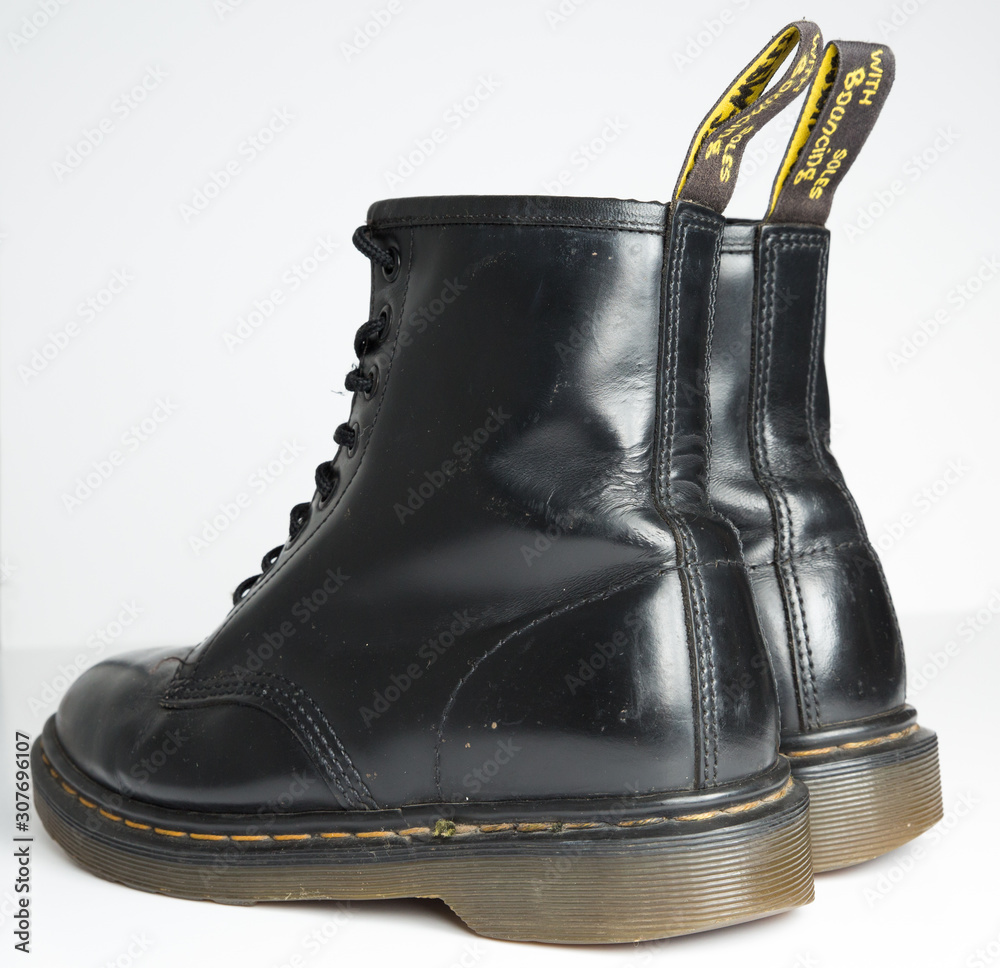 london, england, 05/05/2019 Dr Martens 1460 Black Leather Boots 8 Eye lace  hole. fashionable punk historic british made leather boots. dr martens air  war with bonding soles. built to last. Stock Photo | Adobe Stock