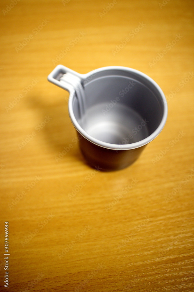 Plastic coffee cup on a light table Plastic coffee cup on a light table
