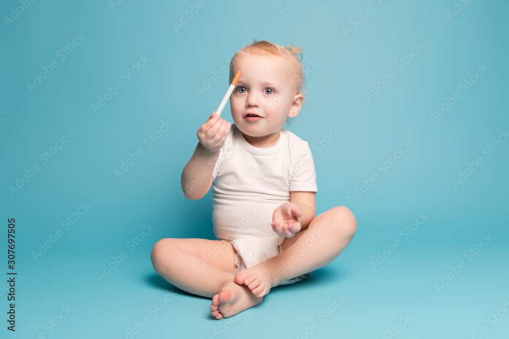 baby girl shows the viewer a cigarette in her hand baby girl shows the viewer a cigarette in her hand