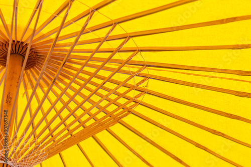 Fototapeta Naklejka Na Ścianę i Meble -  Yellow bamboo wood umbrella,Thai style handmade