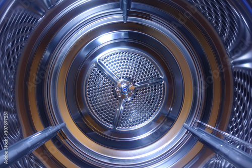 Closeup photo of latest technology stainless steel electric dryer drum