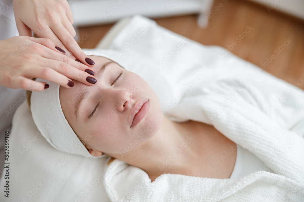 young girl in beauty salon, laser epilation and beauty