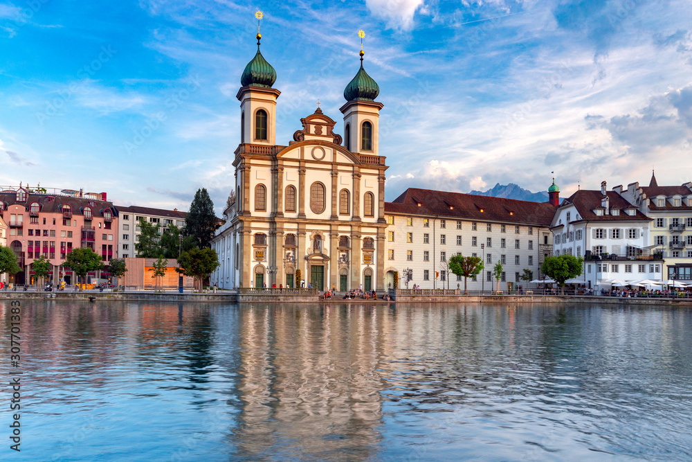 Lucerne. Old city embankment and medieval houses at dawn.