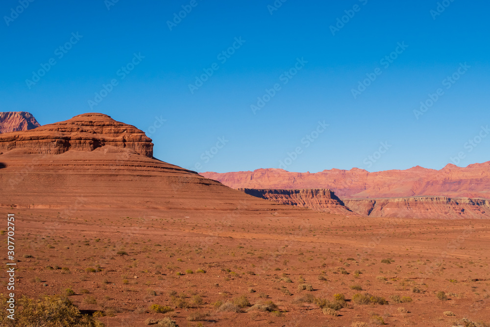 Landscape of barren red hillside and terrain at Marble Canyon in Glen Canyon National Recreation Area in Arizona