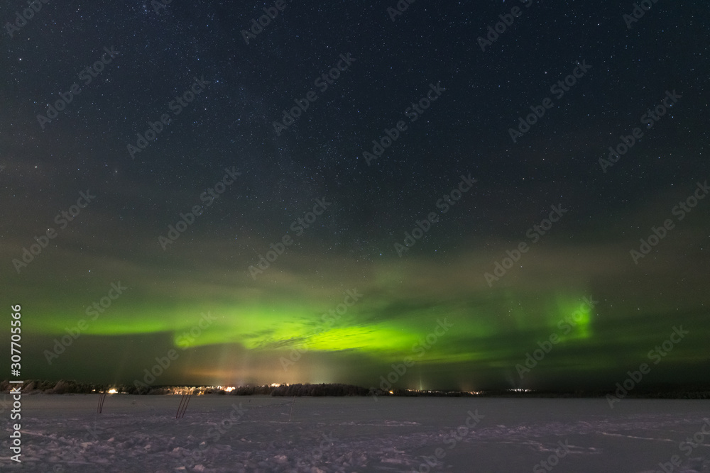 Aurora borealis and starry sky over Lapland