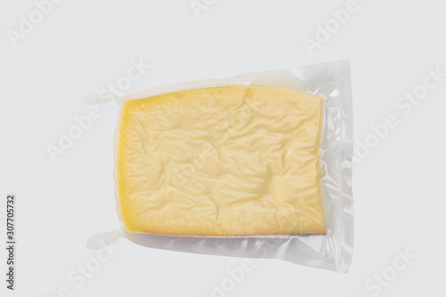ellow cheese in plastic packaging