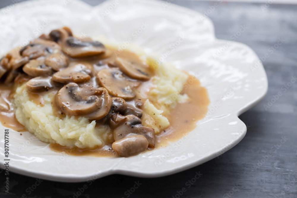 mashed potato with mushrooms and sauce on white dish mashed potato with mushrooms and sauce on white dish