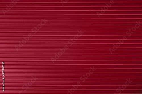 Red ribbed metallic surface...