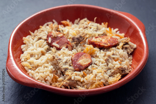 typical portuguese dish rice with duck and smoked sausage