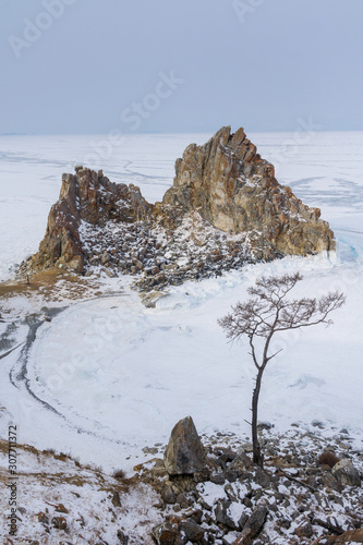 winter landscape with rock Shamanka on Baikal