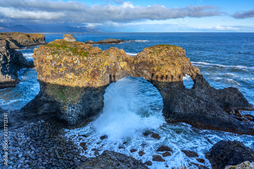 impressive baalt rock arch eroded by the surf of the atlantic ocean, Snaefellsness peninsula, western Iceland photo