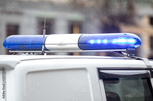 turned on blue flashing light of a police car