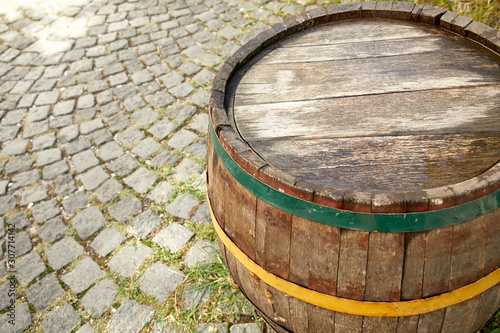 old wine barrel on the paving stones