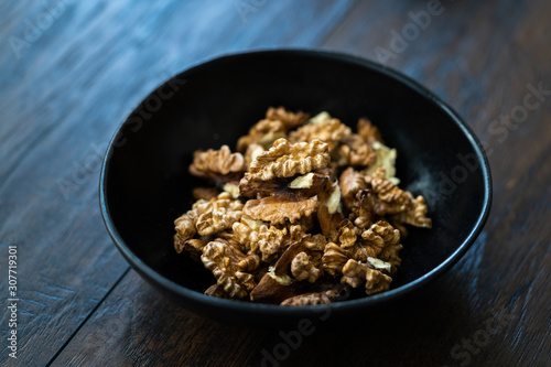 Walnut Kernels and Whole walnuts in Porcelain Bowl.