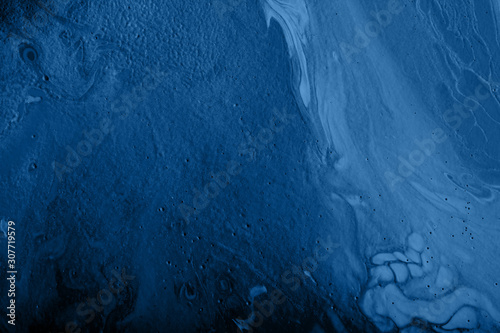 Abstract handmade composition made in the technique of fluid art.