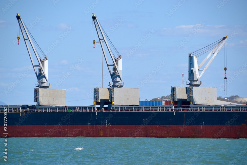 Large marine coal transport ship or vessel being loaded in the port of Gladstone in Queensland, Australia