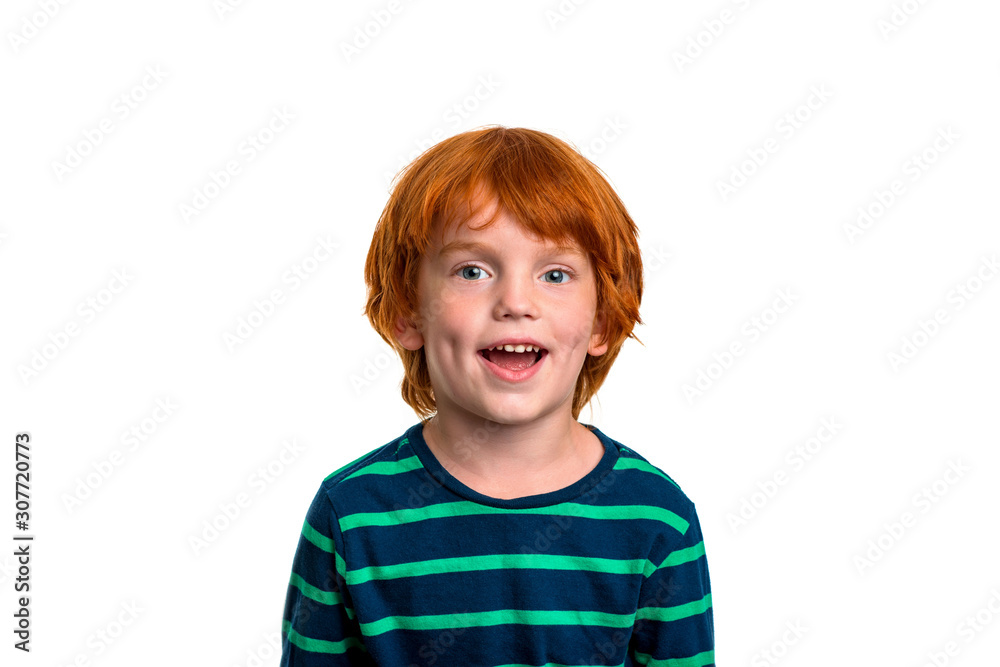 Waist up portrait of little redhead smiling boy wearing green shirt, isolated Waist up portrait of little redhead smiling boy wearing green shirt, isolated