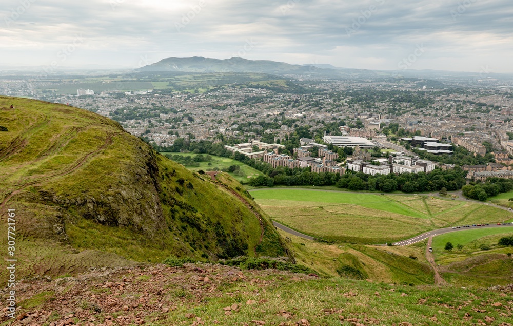 Landscape of Edinburgh city in Scotland from Arthurs Seat in overcast weather
