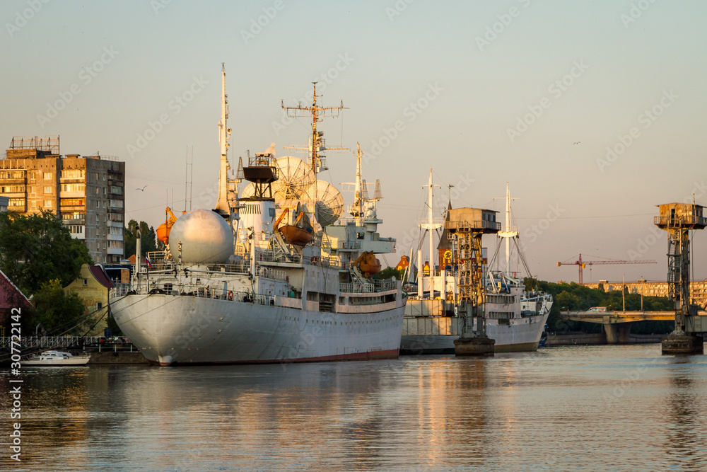 Ships in the river port of Kaliningrad at sunset
