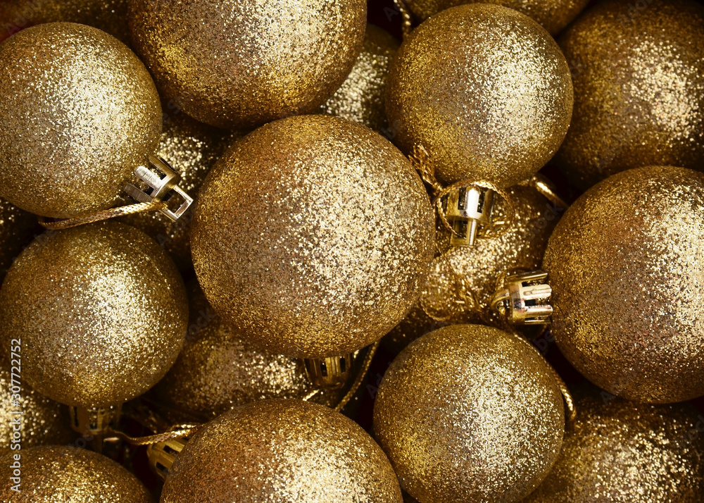 Golden Christmas balls as a background.Fir tree toys festive decoration.Winter holidays,Merry Christmas,Happy New Year concept. Copy space. Golden Christmas balls as a background.Fir tree toys festive decoration.Winter holidays,Merry Christmas,Happy New Year concept. Copy space.