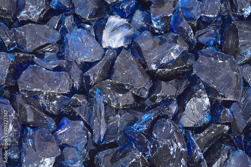 Black minerals shine bright blue, close-up
