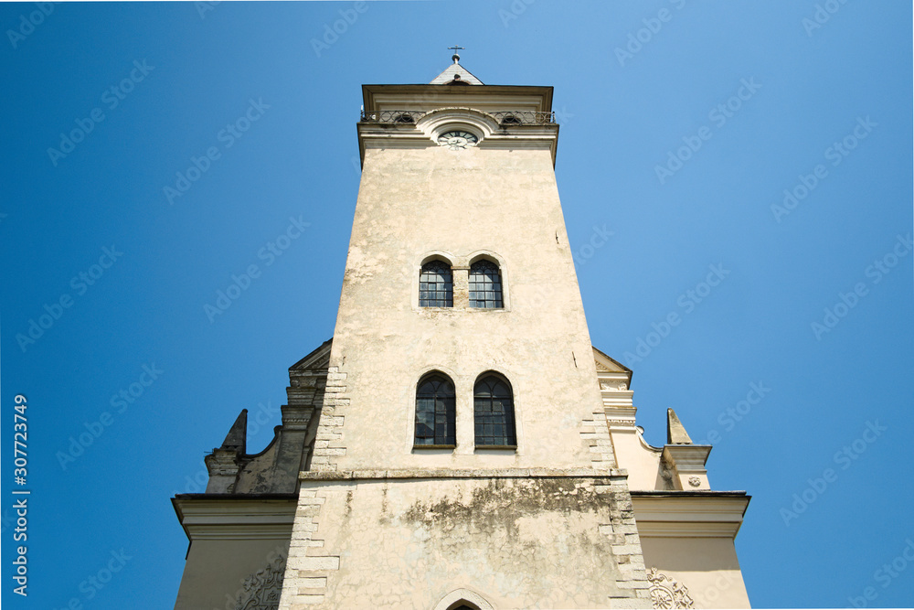 Facade of old catholic church of Saint Nicolas in Rogatin town. Ivano-Frankivsk region, Ukraine