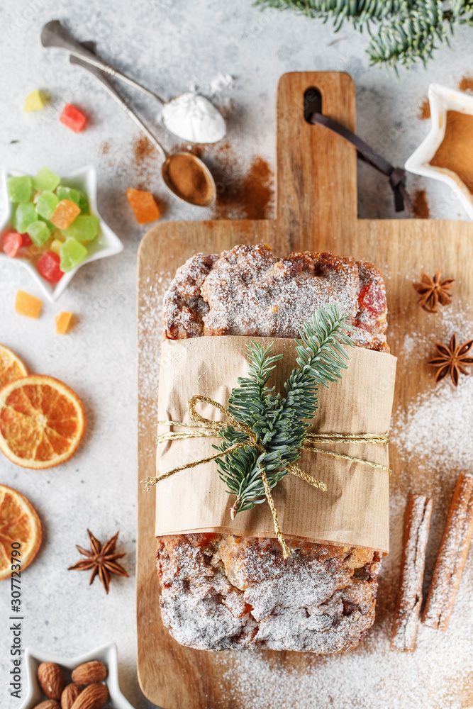 Stollen is fruit bread of nuts, spices, dried or candied fruit, coated with powdered sugar. It is traditional German bread eaten during the Christmas season. New year prep. Stollen is fruit bread of nuts, spices, dried or candied fruit, coated with powdered sugar. It is traditional German bread eaten during the Christmas season. New year prep.