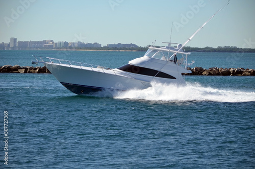 High-end sport fishing boat speeding on Government Cut off Miami Beach,Florida