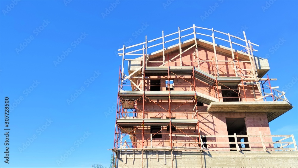 Reconstruction of block of houses with scaffolding