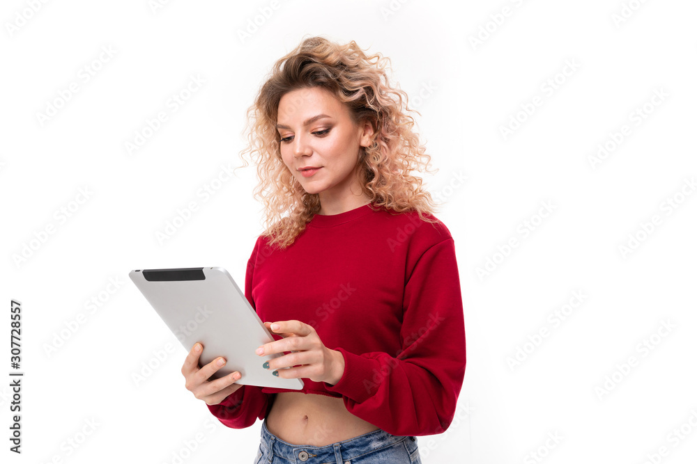 attractive blonde with a tablet on a white background