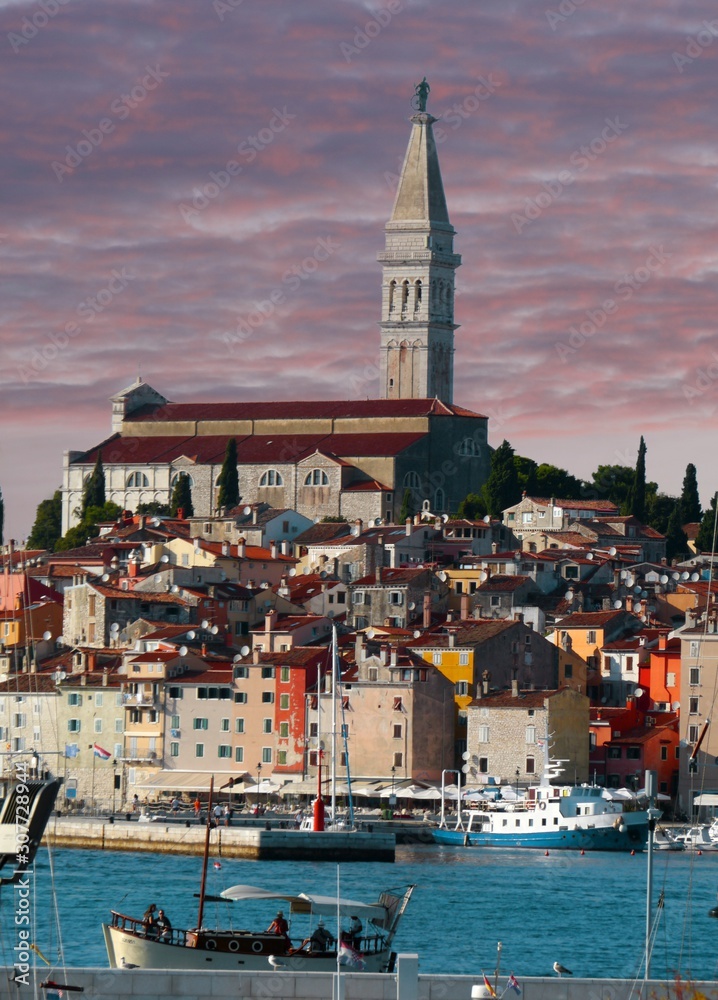 Old town architecture and Adriatic sea surrounds Venetian old town of Rovinj, Istria peninsula.