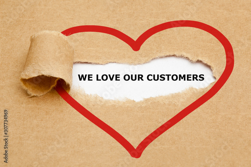 Φωτογραφία We Love Our Customers Torn Paper Concept