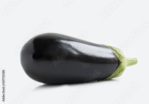 Aubergine isolated on grey background. Eggplant close up photo.