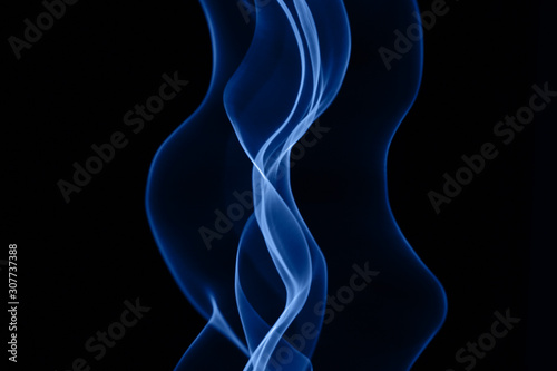 Neon blue smoke abstract. Color of the year concept. Isolated on black background. Neon lights texture.