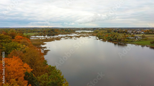 Fototapeta Naklejka Na Ścianę i Meble -  Doles Sala is  the Second Largest Island in Latvia. This is a Peninsula in the Daugava River, Near the Borders of Riga. Aerial Dron Shoot. Sunny Autumn Day.