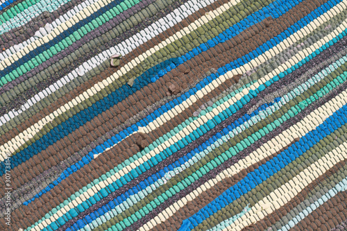 detail of blue rug with diagonal lines