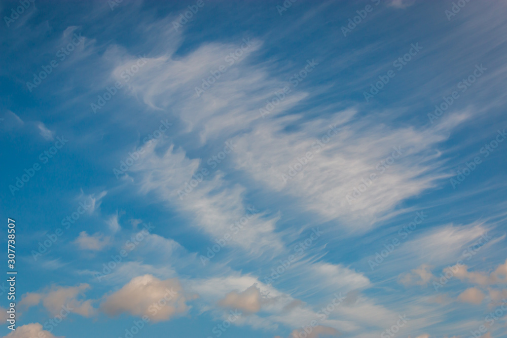 Cirrus clouds stretched on blue summer sky Cirrus clouds stretched on blue summer sky